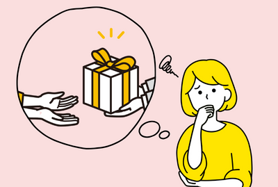 右側に困っている女性、左側に心の声を表す吹き出しを配置。吹き出しの中にはプレゼントを渡した場面を描いています。